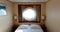 Ship Cabin With Bed And Window With View On Sea. Luxury Cabin On Ferry Boat Or Cruise Liner