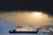 Ship ferry landing arrival at dock port under black storm clouds in the sky Wemyss Bay Scotland