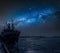 Ship on a frozen sea in winter and milk way