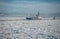 Ship going through the ice sea. Winter fairway