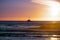 Ship heading to the harbor, at sunset, Moss Landing, California