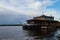 Ship house on the water on the Dnieper river in Ukraine in spring at sunset