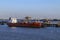 Ship moored near an oil refinery - Humber Estuary - England.