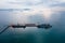 Ship with oil tanker , floating Storage Unit for import export petroleum gas LPG and CNG at evening rainstrom background aerial