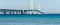 Ship passes under the Mackinac Bridge in Michigan