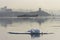 A ship in the port of Vladivostok on a foggy  morning in the Golden Horn Bay, covered with floating ice floes