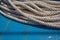 Ship rope detail on turquoise wooden background