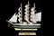 Ship Sailboat Wooden Model on a Black Background