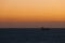 Ship sailing in the Mediterranean sea at sunset