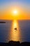Ship sailing into the sunset, Santorini island, Greece, Europe