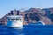 Ship sea trip. Santorini, Cyclades, Greece. Amazing Santorini view on white cave houses from the Aegean sea. Santorini, Cyclades,