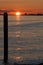 Ship silhouette and post at sunset on Pacific