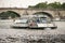 Ship with tourists sailing on the Seine on a study tour of Paris