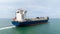 ship transport sailing full speed in sea photograph from drone camera aerial view