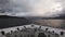 A ship travels trough a Norwegian Fjord.