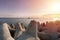 Ship-tugboat goes in high seas to tow cargo ship to port. Beautiful sunset over the pier. Tetrapod breakwaters in harbor