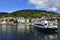 Ship and typical old buildings in Bryggen district in Bergen, a beautiful city in Norway