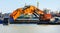 Ship with working excavator on board