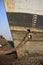 Shipbreaking Yard in Darukhana, Mumbai, India â€“ INS Vikrant dismantling with scrap metal & workers in background