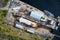 Shipbuilding construction ship in dry dock aerial view at shipyard harbour with scaffold