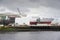 Shipbuilding and crane in Glasgow on the River Clyde showing ship being built in progress