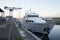 Shipbuilding crane and luxury boat at marina moored