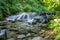 Shipot waterfall on a mountain river among stones and rocks in the Ukrainian Carpathians