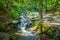 Shipot waterfall on a mountain river among stones and rocks in the Ukrainian Carpathians