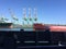 Shipping container cranes for loading ocean cargo ship vessel