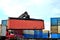 Shipping container loading by richtracker on the freight rail car at logistic warehouse port.