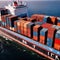 Shipping container vessel stacked with cargo containers used for transport of goods international across ocean