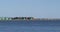 Shipping containers stacked along the banks of the main channel at the Port of Los Angeles