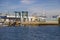 A shipping yard with docked boats and yachts with blue sky and clouds at Seabridge Park in Huntington Beach California