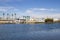 A shipping yard with docked boats and yachts with blue sky and clouds at Seabridge Park in Huntington Beach California