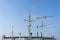 Ships antenna and navigation system on a ferry boat with sunlight and blue sky in background, Thailand