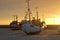 Ships on the beach at sundown, Denmark.