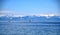 Ships on blue lake, clear blue sky, and snowy mountains, Boden Lake and Schwitzer Alps, view from Insel Mainau on spring