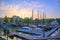 Ships docked along the canals in Rotterdam, Netherlands at sunset