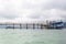 Ships that are docked in old wood , Waiting for tourists, while the rain clouds are forming.