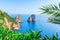 Ships at Faraglioni cliffs and Tyrrhenian Sea of Capri Island