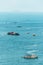 Ships floating over the sea with tourist playing Parasailing in Pattaya, Chonburi, Thailand