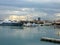 Ships in the harbor in Valencia, Spain under  a clouded sky