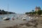 Ships on low tide dry harbour bed in Bretagne France