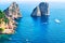 Ships near Faraglioni cliffs and Tyrrhenian Sea of Capri Island