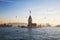 Ships, seagull, dolphin, Maiden tower in the Bosphorus early in the misty morning, Istanbul,