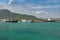 Ships, vessels, boats, containers, industrial buildings at the Puerto Plata harbor, port and cityscape, Dominican Republic