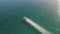 Ships wake, top view. Aerial drone shot over the boat. Foam trail with waves