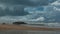 A shipwreck close to shore with stormy skies