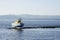 Shipwreck ship boat marooned on rocks at sea coast water remote area uninhabited island