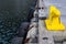 Shipyard Dock With Tire Bumpers Hanging And Bright Yellow Anchor Point